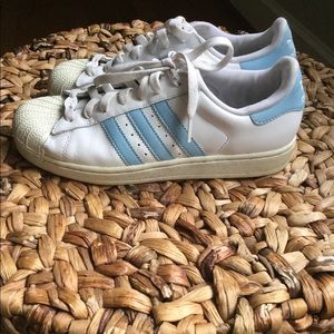 Original shell-toe Adidas with baby blue stripes
